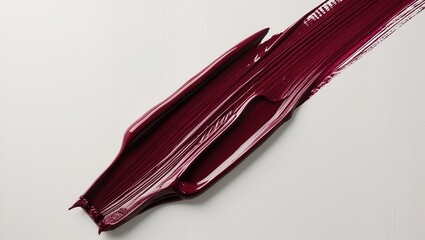 Maroon brush stroke of oil paint isolated on white  creamy background