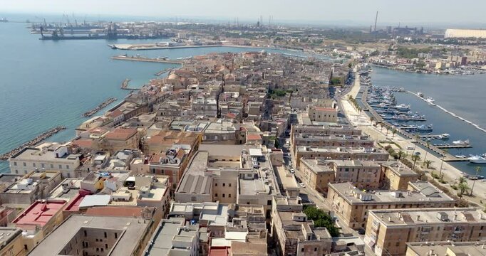 Aerial view of the old town of Taranto, Puglia, Italy. In background is the ILVA plant.