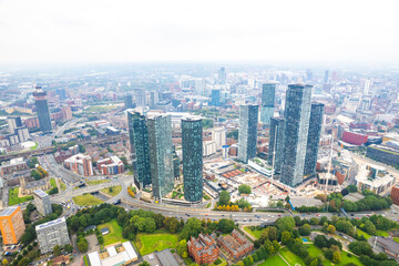 Obraz premium Commercial area, highrise tower office building in Deansgate Manchester, overcast day, aerial view