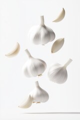 Many falling head of garlic, garlic clove isolated on white background. Flying garlic in the air