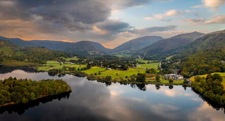 Aerial panoramic landscape of the lake and village of Grasmere in The  English Lake District at sunrise