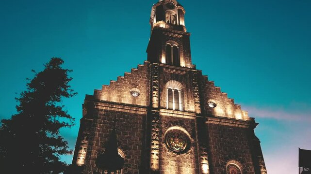 Matriz Church in the center of Gramado city, Rio Grande do Sul lit up at night on a beautiful day with a clear sky