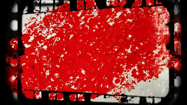 A striking visual of a chaotic red splatter on a textured backdrop, evoking tension and drama through dynamic editing.
