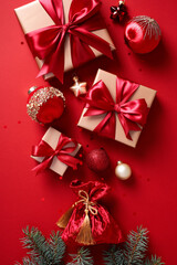 Santa's sack full of Christmas gifts on red background