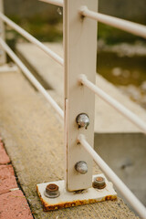 Details of the bridge. Metal fencing, flooring, fasteners, fittings