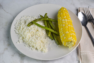rice along with green beans and corn