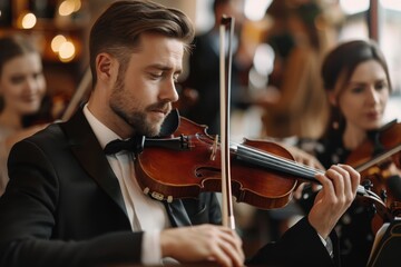 String quartet performing at wedding reception in restaurant musicians playing violin and cello at theater musical concept
