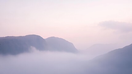 Fototapeta premium Misty Mountain Range at Dawn - A Breathtaking Landscape