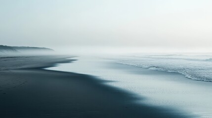Obraz premium Serene Beachscape with Fog and Waves