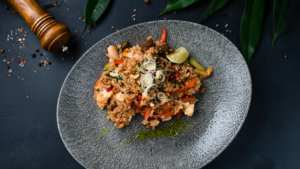 Asian food rice with chicken, shiitake mushrooms, zucchini, sweet peppers, lime and onion.