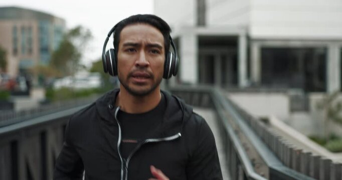 Man, fitness and run in headphones for sports, exercise or workout with training as runner in Netherlands. Male person, cardio and jog for activity, strong muscle and wellness in outdoor as athlete
