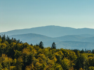 Fototapeta premium Beskid Maly aerial panorama of potrojna hill and czarny gron.Little Beskids mountain range in summer.Aerial drone view of Rzyki Village in Beskid Maly Poland.Czarny gron ski resort in Rzyki.