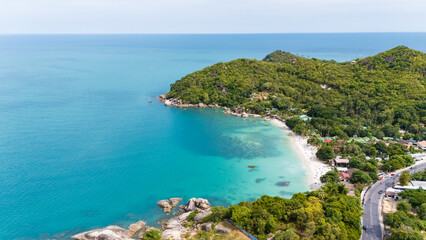 aerial drone shot of silver beach, koh samui, thailand. turquoise water, white sand, palm trees, and lush greenery create a serene tropical paradise, perfect for travel and tourism imagery.