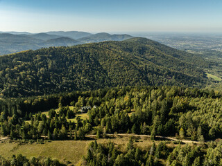 Naklejka premium Beskid Maly aerial panorama of potrojna hill and czarny gron.Little Beskids mountain range in summer.Aerial drone view of Rzyki Village in Beskid Maly Poland.Czarny gron ski resort in Rzyki.