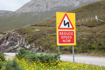 Reduce speed now sign in Scottland, Holiday trip in Great Britain, Deceleration
