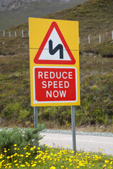 Reduce speed now sign in Scottland, Holiday trip in Great Britain, Deceleration