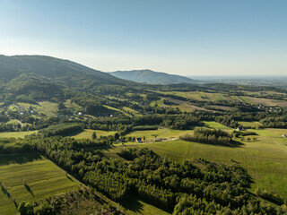 Obraz premium Beskid Maly aerial panorama of potrojna hill and czarny gron.Little Beskids mountain range in summer.Aerial drone view of Rzyki Village in Beskid Maly Poland.Czarny gron ski resort in Rzyki.