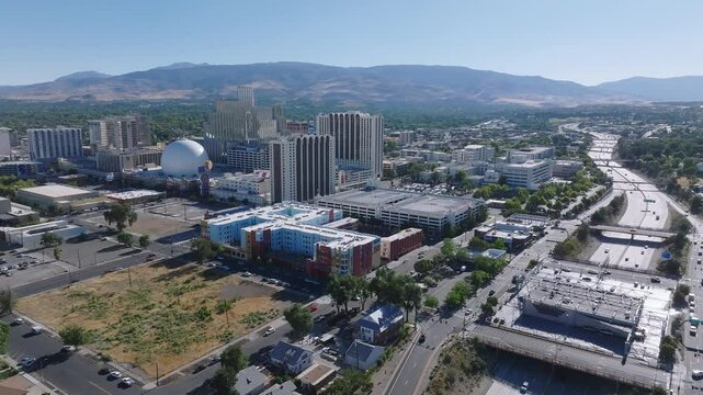 Panoramic aerial view of the city of Reno cityscape in Nevada. Downtown Reno, Nevada, with hotels, casinos and the surrounding High Eastern Sierra foothills.