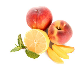 Fresh peaches, lemon and mint on white background