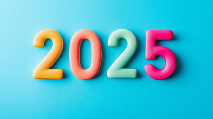 Multi-colored "2025" numbers on bright blue background with playful pastel tones