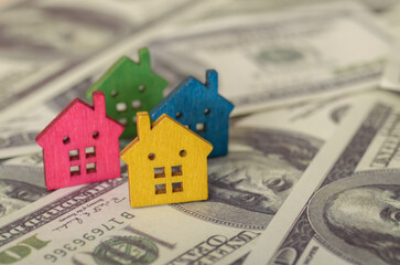 The combination of colors and shapes in the houses symbolizes the variety of choices available in the housing market.