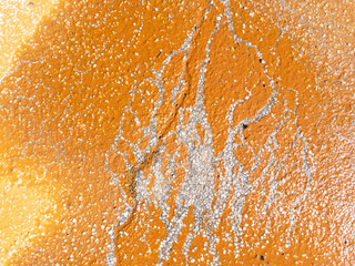 Colored orange stain on the pavement