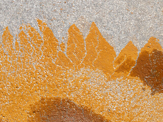 Colored orange stain on the pavement