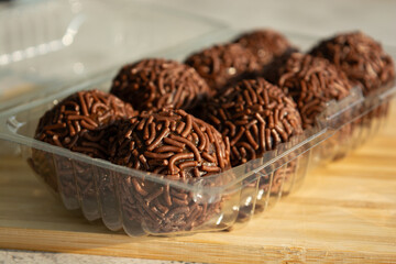 Close-up of chocolate brigadeiros, a popular Brazilian dessert.