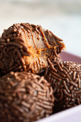 Close-up of a chocolate brigadeiro, a popular Brazilian dessert.