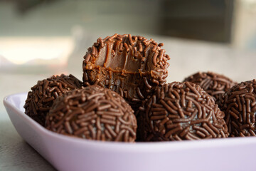 Close-up of a chocolate brigadeiro, a popular Brazilian dessert.