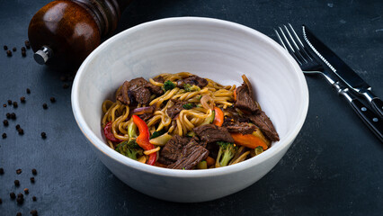 Fresh udon noodles with beef, onions, broccoli and sweet peppers.