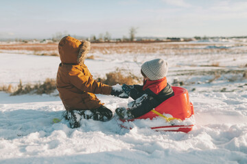 Children playing on a cold winter day. 