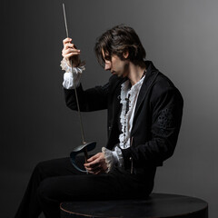 A dramatic hero with a sword in his hands experiences sadness and melancholy, the style of...