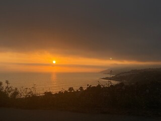 sunset from the mountains on the water west coast