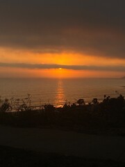 sunset from the mountains on the water west coast