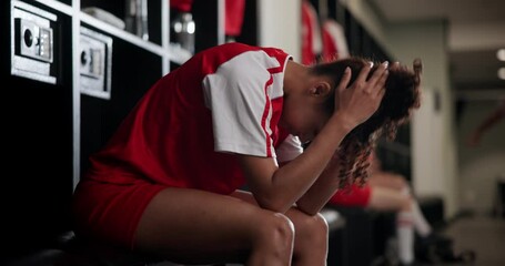 Locker room, sports and woman soccer player with failure at game, training or tournament in Paris. Upset, regret and female football athlete in cloakroom thinking of mistake in match or practice. - Powered by Adobe