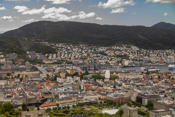 Naklejka premium View of the City and Mountains surrounding Bergen Norway on a Summer Day from Atop Mount Fløyen at the Fløibanen Funicular Station