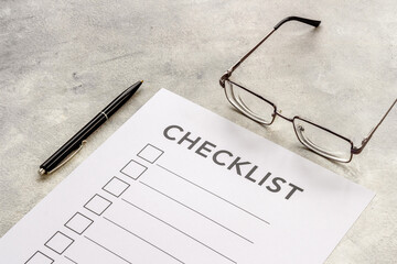 Fototapeta premium Checklist concept. Blank checklist with empty boxes on office table