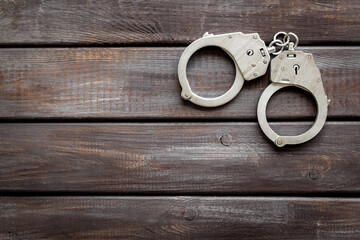 Police metal handcuffs top view. Criminal offense and detention concept