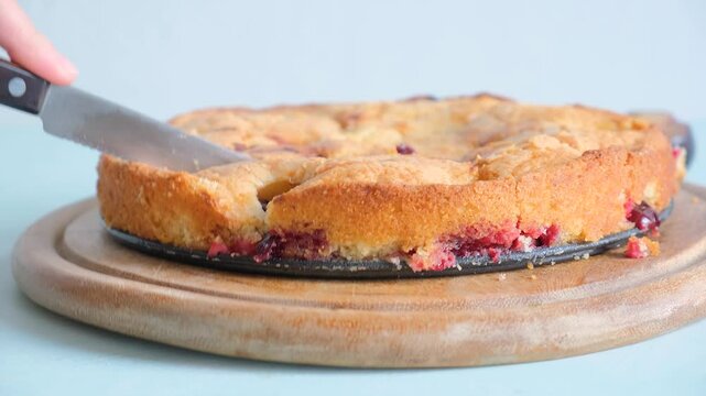  The New York Times Plum Torte. Hand cutting plum pie