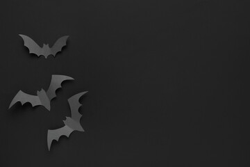 Paper bats for Halloween party on black background