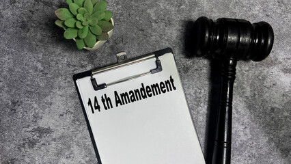 Concept of 14 th Amandement write on paperwork isolated on wooden background.