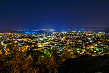 A city at night with lights on the buildings