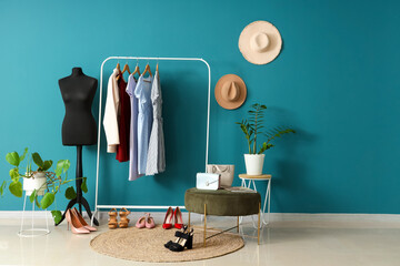 Interior of dressing room with mannequin, pouf and clothes rack