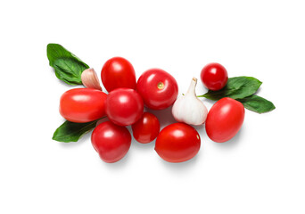 Fresh ripe tomatoes with garlic and basil on white background