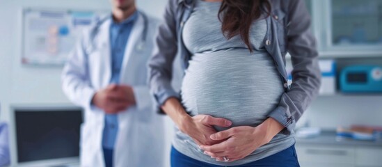 Fototapeta premium The doctor is wearing a white coat and the woman is wearing a gray shirt