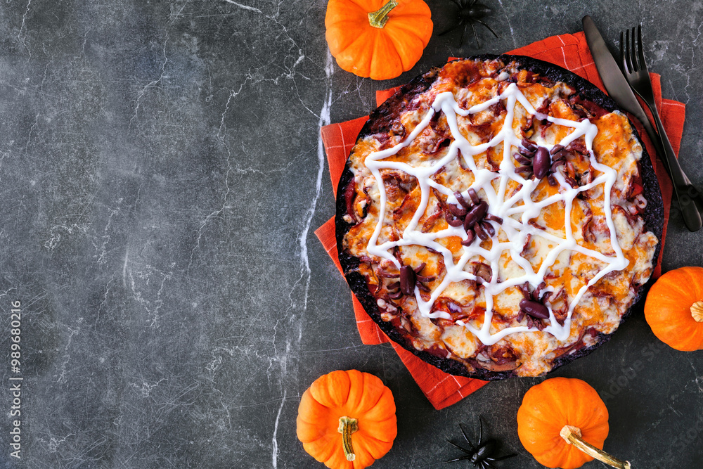 Poster halloween spider web pizza. above view table scene on a dark stone background with copy space. black