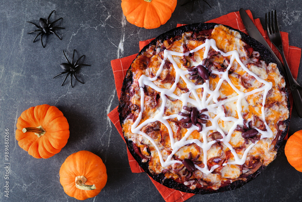 Poster halloween spider web pizza. top down view table scene on a dark stone background. black crust with g