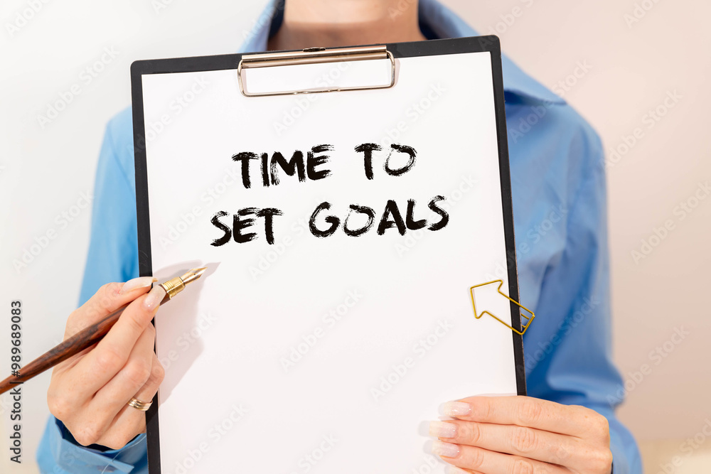 Poster time to set goals text written on paper card on blue background with chart