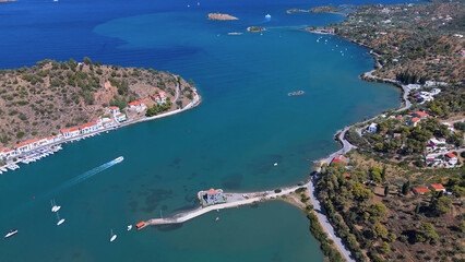 Fototapeta premium greece peloponnese region poros island houses clock tower and boats aerial view on daylight